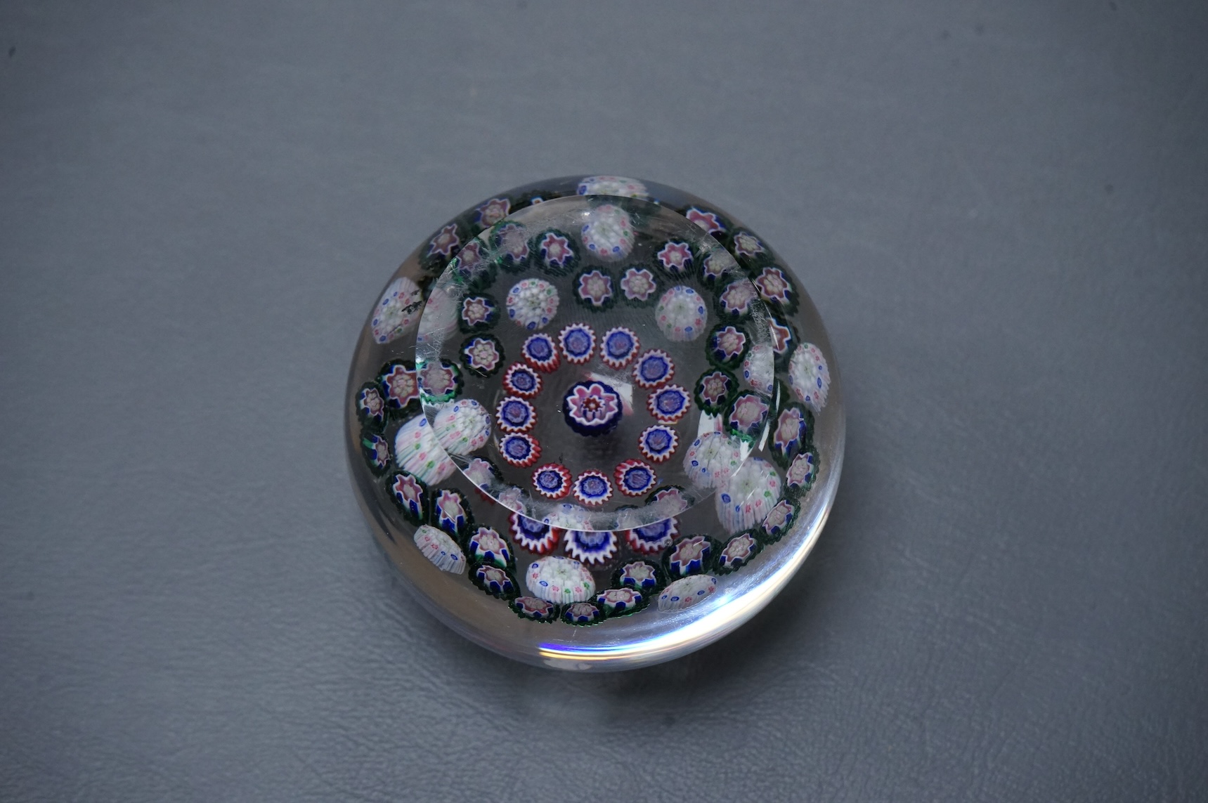 A Clichy glass garland paperweight, 7cm diameter.
